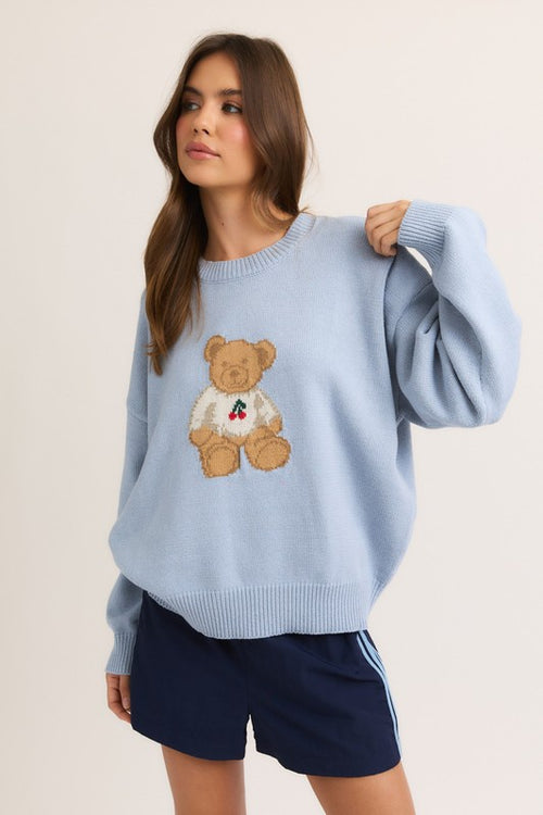 Miss Behavin' Cherry Sweater in light blue shown from the side with oversized sleeves