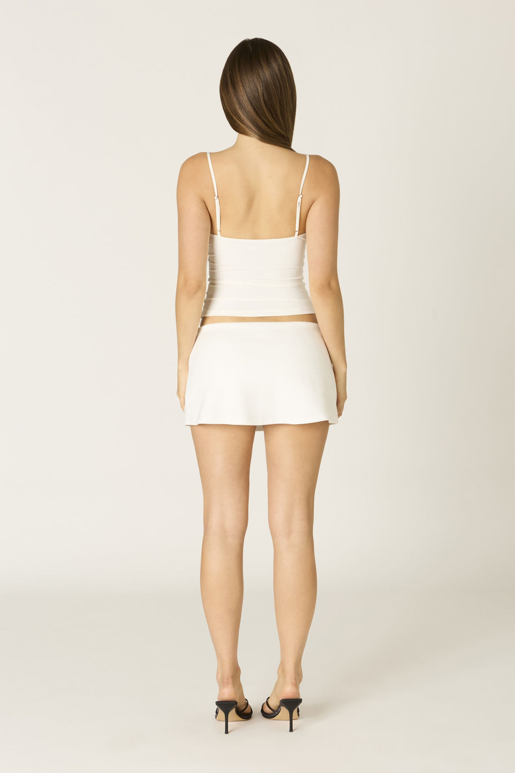 Sage skort in white at Miss Behavin'