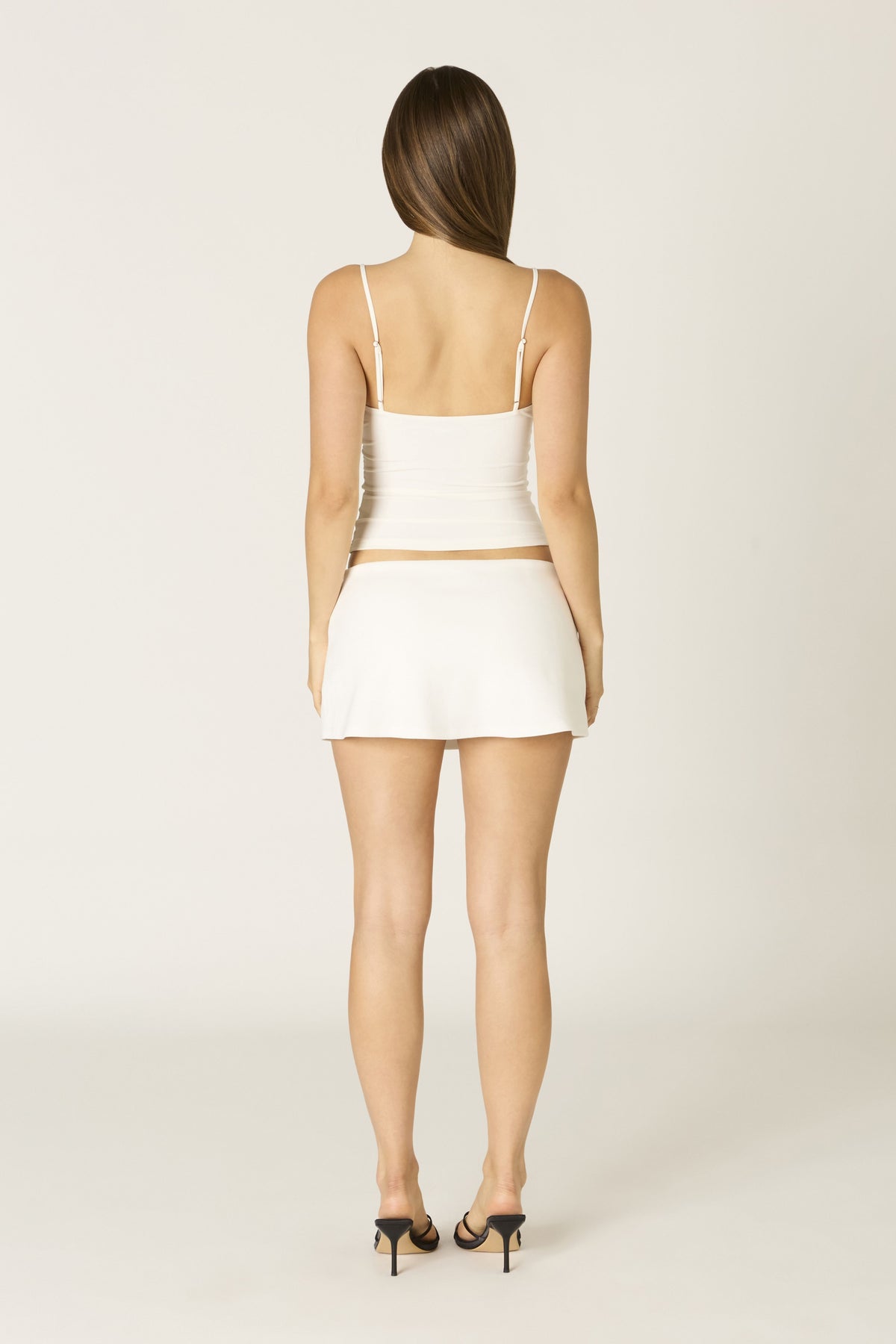 Sage skort in white at Miss Behavin'