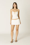 Sage skort in white at Miss Behavin'