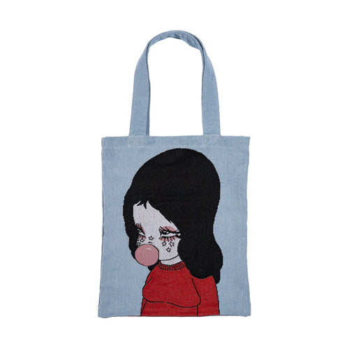 Woven tote with bubblegum girl graphic in red sweater and black hair at Miss Behavin'
