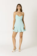 Aquarius Dress in aqua showing flounce hem and thin crisscross straps